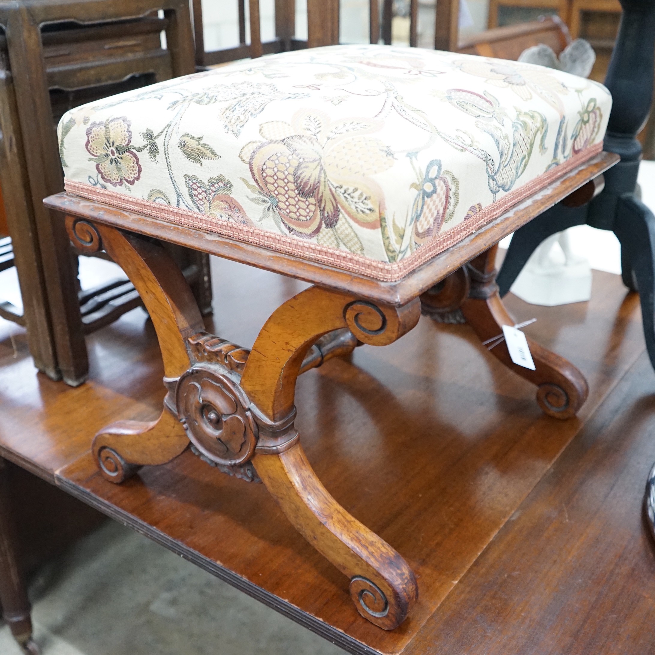 A Victorian rosewood X framed dressing stool, width 53cm, depth 44cm, height 46cm